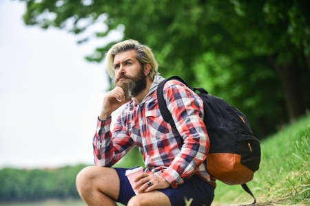 Inspired handsome hipster. Inspiration. Man outdoors with cup of coffee. Drinking hot coffee. Drink...