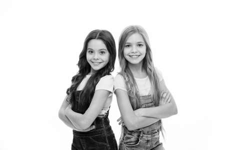 Hair like this is the focus of their look. Beauty and hair salon. Cute little girls wearing new hairstyle. Small girls with long hairstyle. Kids hair grooming. Natural hair styling and dressingの写真素材