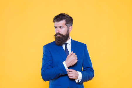 Because you worth it. Handsome guy concept. Confident businessman handsome bearded man in formal suit. Successful handsome hipster top manager. Serious motivated entrepreneur. Barbershop and stylistの写真素材