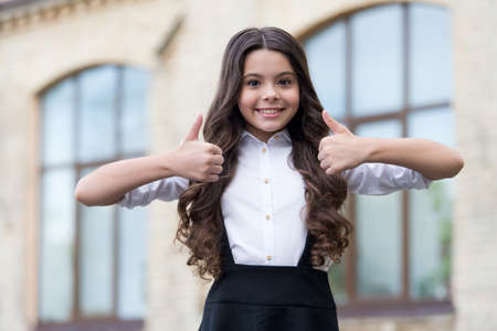 I strive for the best education. Happy child show thumbs ups. Back to school. Formal education....