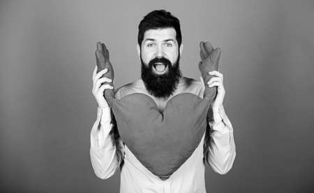 Happy in love. Physical touch. Free hugs. Man bearded hipster hug heart. Celebrate valentines day. Guy with beard and mustache in love romantic mood. Feeling love. Dating and relations conceptの写真素材