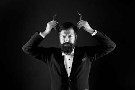 Hot Chilli Pepper. hot as in hell. extra strong. Pepper harvest industry. peppery man with devil horns. happy bearded businessman has pepper moustache. male spicy taste. for the thrillの写真素材