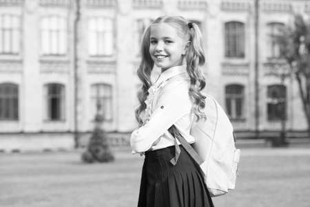 Back in September. Happy child go to school. Little girl wear school uniform. September 1. Back to school. Back to class. School pack. Education and study. Back to learning. Startupの写真素材