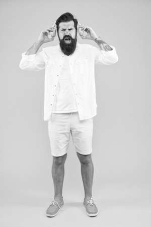 Loud music. Hearing problem. Bearded man headphones. Active Noise Cancellation Technology. Hipster listen music stereo headphones. Modern wireless headphones. Dance music tracks. Ears healthの写真素材