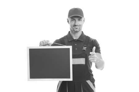 Planning a new construction. presenting useful information. man in overall with empty board. place for copy space. announcement concept. male construction worker with presentation Planning a new construction. presenting useful information. man in overall with empty board. place for copy space. announcement concept. male construction worker with presentation