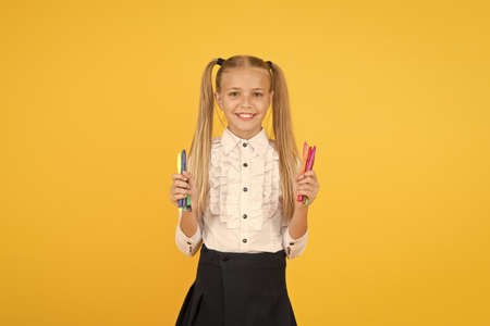 Schoolgirl hold school stationery supplies for crafts. Tutorials for little hands. Favourite part of going back to school. Creative crafts. Develop creativity. Crafts for elementary school kidsの写真素材