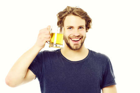 Caucasian guy with happy smile and joyful face holding beerの写真素材