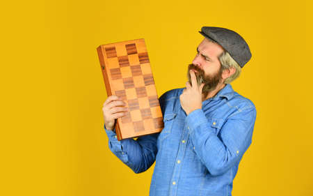Grandmaster experienced player. Game strategy concept. Chess lesson. Cognitive development. Teacher chess competition. Board game. Bearded man playing chess. Chess figures. Intellectual gamesの写真素材