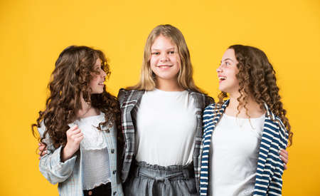 Real friendship. Group girls. Female friendship. Sisterhood and family. Best friends. Back to school. Happy childhood. Cheerful small kids. Togetherness and unity. Goods for girls. Good vibesの写真素材