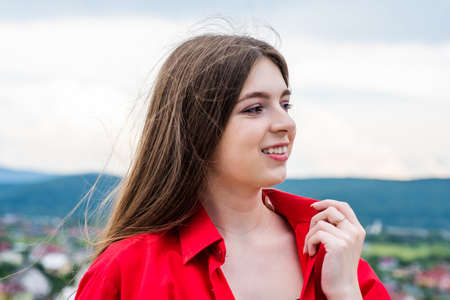 kid beauty standards. fashion and beauty. express real emotions. happy kid casual style. happy childhood. teenage child in stylish red shirt. smiling girl has long hair. Delight in the detailsの写真素材