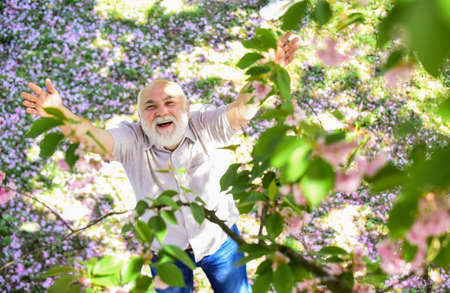 Wow. Happy smiling senior man looking up. old man imagining beautiful good things to realize...