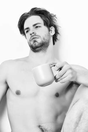 Caucasian bearded sexy macho holding coffee cupの写真素材