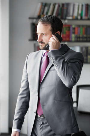 Businessman man talk on mobile phoneの写真素材