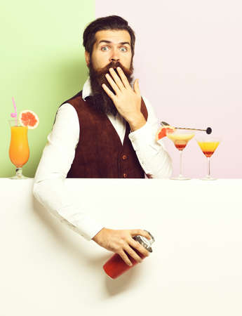 surprised handsome bearded barmanの写真素材