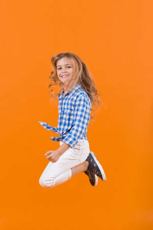 Child bounce with smiling faceの写真素材