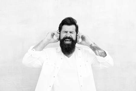 Hipster listen music stereo headphones. Modern wireless headphones. Electronic dance music tracks. Instrumental music. Bearded man headphones. Enjoy every note. Active Noise Cancellation Technologyの写真素材