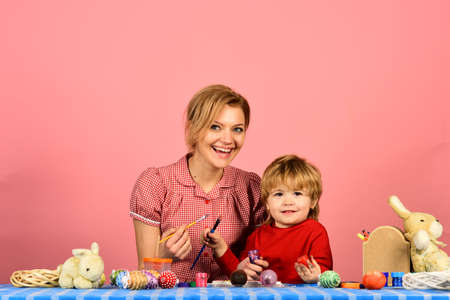 Family prepares for holiday on pink background