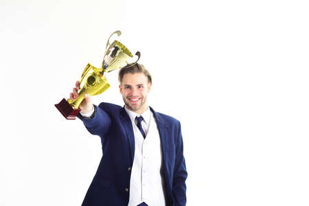 Winner holds golden award and smiles. Leadership, positive emotion, success concept..