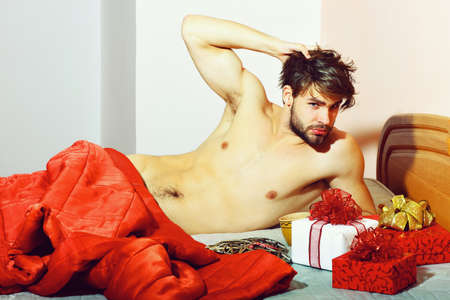 handsome bearded macho sexy man on athletic body on colorful backgroundの写真素材