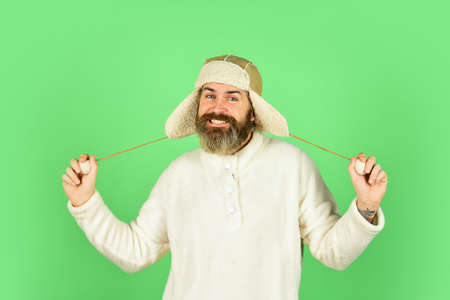 Winter fashion. Cold weather. Beard care winter season. Facial hair concept. Fur garments. Bearded...