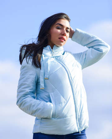 Beauty and fashion look. Girl spring jacket blue sky background. Woman fashion model outdoors. Feel...