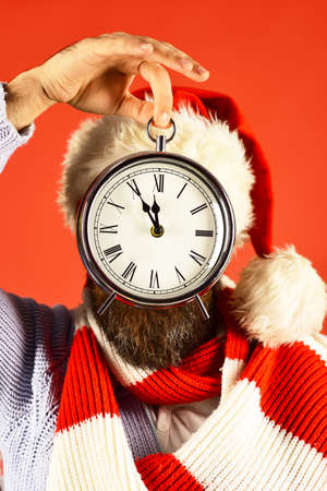 Santa with red hat and scarf. Time left to holiday