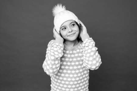 Adorable baby. Angel child. Child in cosy knitted outfit. Winter fashion. Childhood happiness....