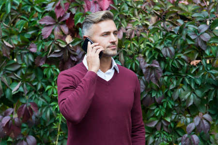 serious businessman answer the phone call, business callの写真素材