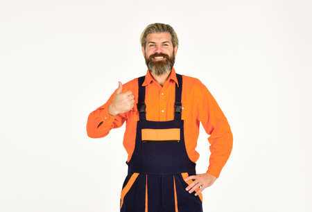 Reputation of excellent worker. Skillful worker. Electrician plumber handyman. Repairman. Construction worker. Renovation concept. Mechanic perform technical work. Bearded mature man in uniformの写真素材