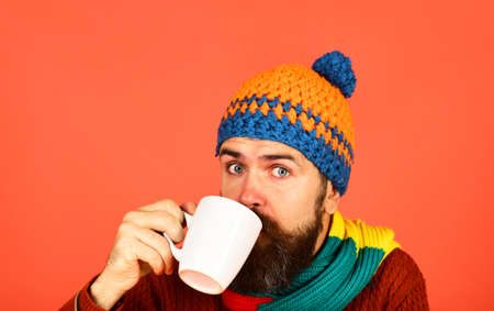 Caffeinated or decaf beverages idea. Man in warm hatの写真素材