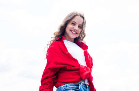 childhood happiness. happy childrens day. free your imagination. kid beauty and fashion. child wearing casual style. Child on the background of sky. summer holiday conceptの写真素材