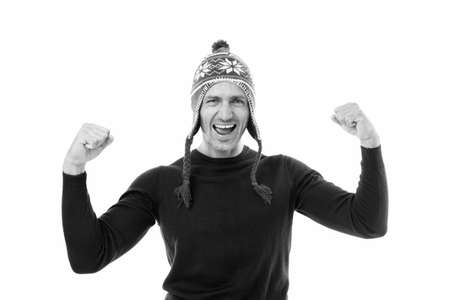 Positive emotions. Handsome man celebrate winter holidays white background. Guy wear winter hat. Merry christmas and happy new year. Best wishes. Winter vacation. Mature man in hat face bristleの写真素材