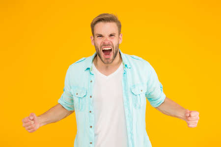 pure rage. negative human emotions. sexy boy with trendy hairstyle wear shirt. handsome unshaven man with bristle. male summer casual fashion style. angry guy has groomed hair shoutingの写真素材