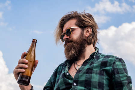 cheers. bearded man drink beer. handsome brutal man. time to relax. mature hipster with beard...