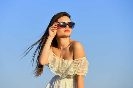 Carve out time for yourself. Harmony and balance. Female psychology. Beautiful woman on sunny day blue sky. Female power. Summer fashion. Find inner strength. Girl in sunglasses copy space. Freedomの写真素材