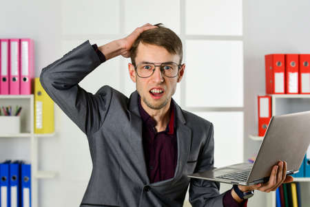 Man with laptop online job marketing specialist, deadline coming concept