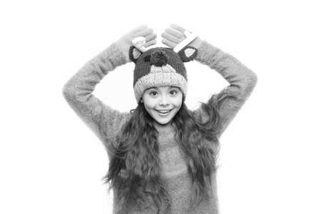 Cute accessories. Girl wear winter theme accessory. Christmas time. Fun and joy. Festive spirit. Cheerful kid. Playful cutie. Adorable baby wear cute winter knitted hat. Cute reindeer with red noseの写真素材