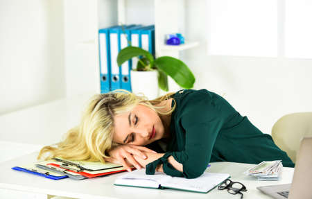 sick and tired. Online shopping. e-commerce and internet banking. bitcoin money withdrawal. loan or saving money for future investment concept. woman auditor doing tax report or money inspectionの写真素材