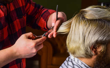 retro and vintage. Designing haircut. barber tools in barbershop. hairdresser cutting hair of male client. Hairstylist serving client at barber shop. Personal stylist barber. Hair care conceptの写真素材