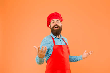 Cook bearded man excited about delicious meals, excellent recipe conceptの写真素材