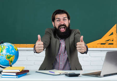 happy man hold thumbs up for success, successful educationの写真素材