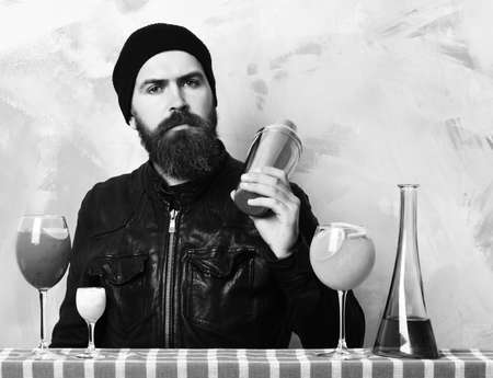 hipster and glasses of alcoholic beverage, cocktails, shot or shakerの写真素材