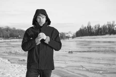Comfortable outfit. Man warm jacket snowy nature background. Exploration of polar regions. Winter...