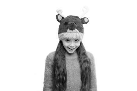 Cheerful kid. Playful cutie. Adorable baby wear cute winter knitted deer hat. Cute reindeer with red...