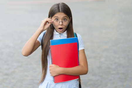 Wow. Surprised child look through glasses outdoors. Sight test. Eye check for school. Vision...