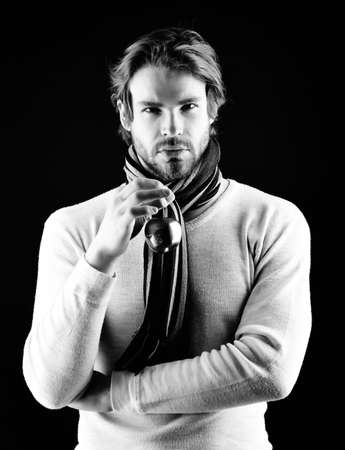 Golden apple and bearded man with scarf and sweaterの写真素材