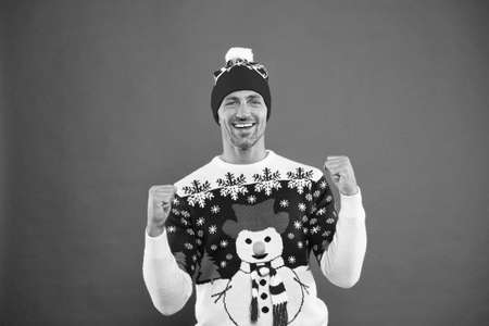 Happy 2020 year. Christmas concept. Guy in funny snowman sweater celebrate winter. Handsome man wear winter sweater. Celebrate new year. Winter sale. Seasonal discount. Diving into christmas moodの写真素材