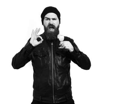 Brutal caucasian hipster holding alcoholic beverage or fresh cocktailの写真素材
