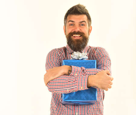 Surprise and holiday gift concept. Macho with wrapped blue gift