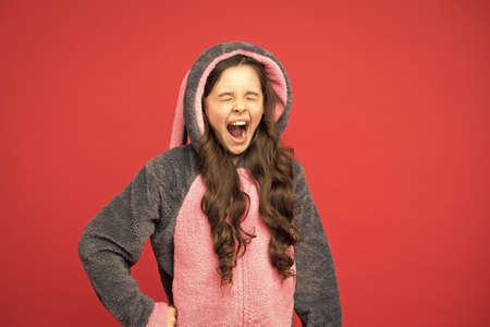 Happy girl in cute pajamas. Baby animal character role